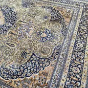 Large Persian wool rug 250x350 cm in gold and navy blue.