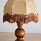 Table lamp in turned wood and umbrella-style leather lampshade