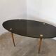 Oval coffee table in black opaline