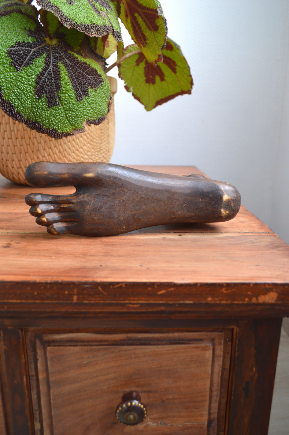 Carved wooden Buddha's foot