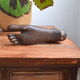 Carved wooden Buddha's foot