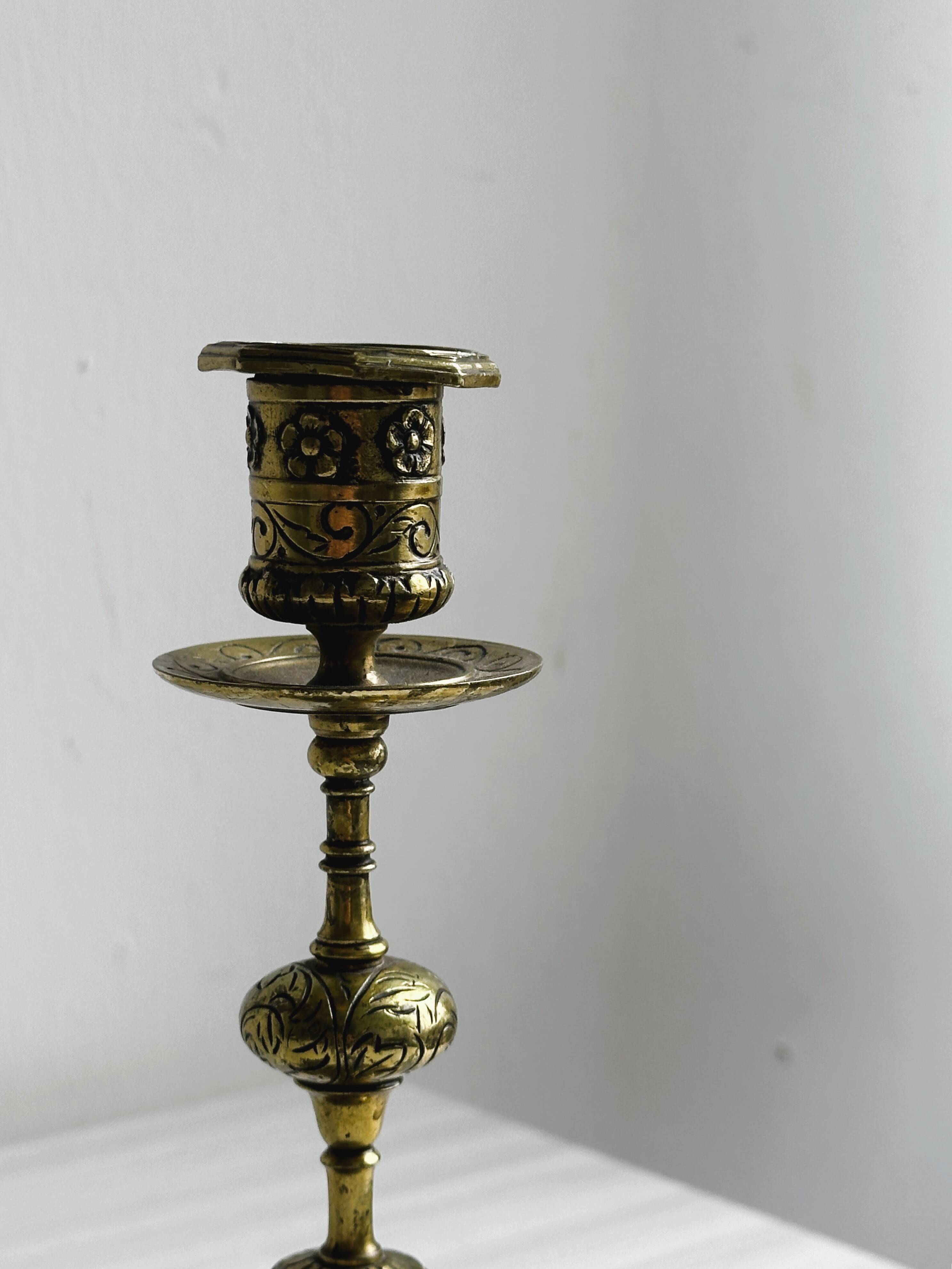 Carved brass candlestick holder