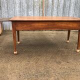 Antique solid cherry farmhouse table with 2 end drawers and 1 pull-out.