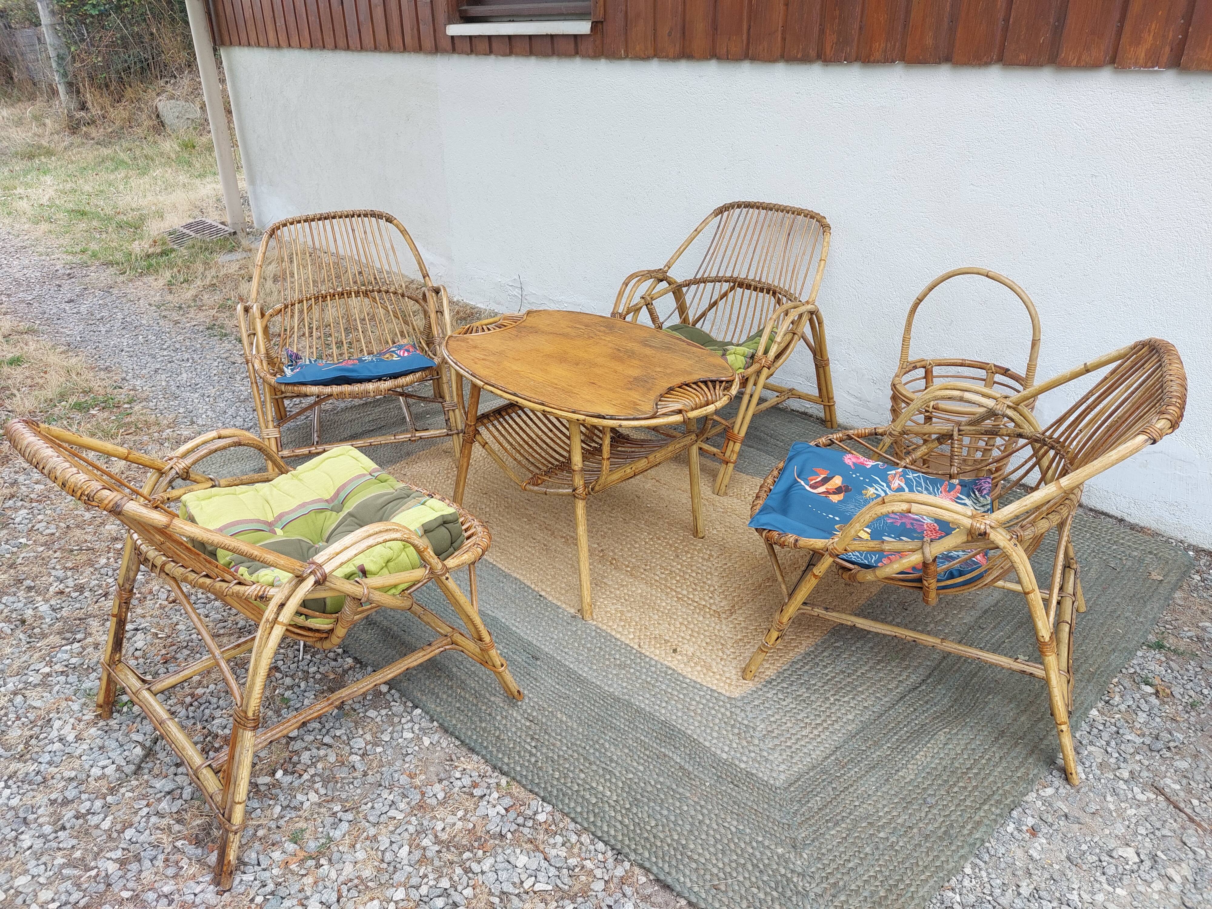 4 armchairs and a coffee table made of rattan and bamboo wood, vintage.