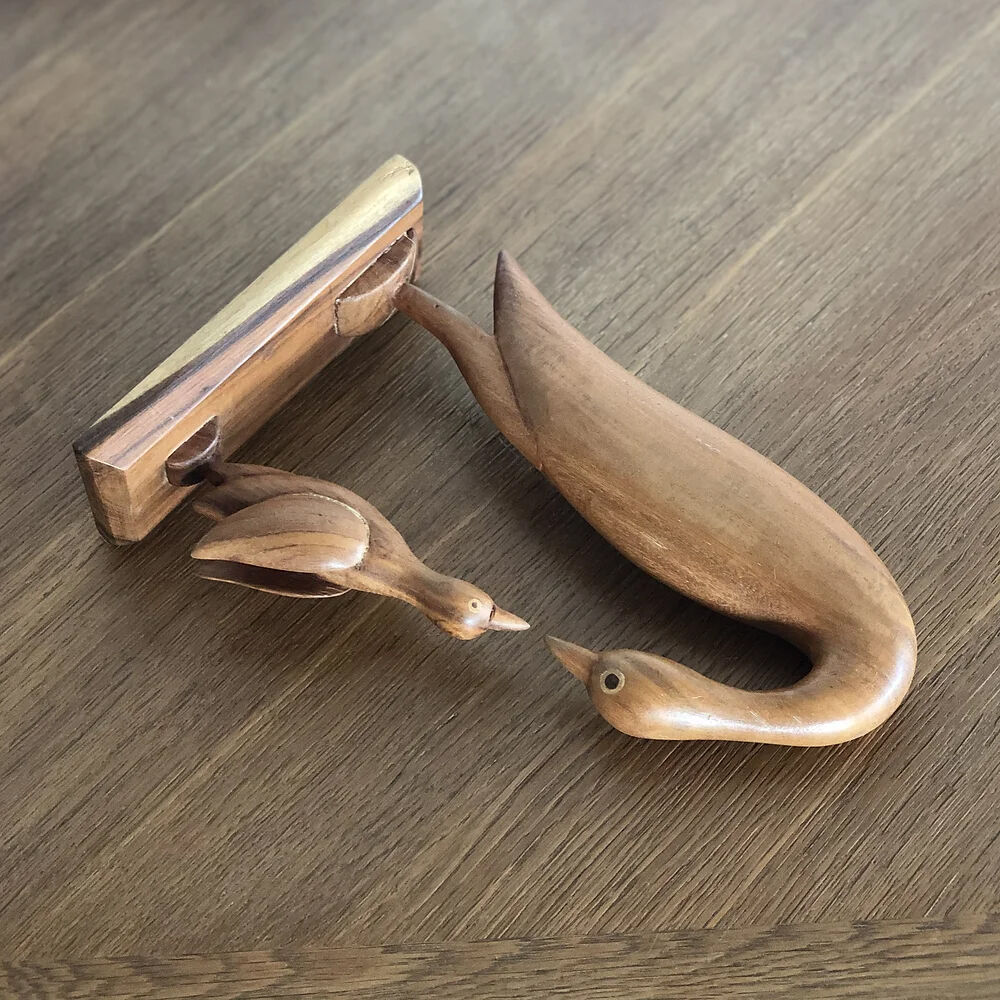 Sculpture of a goose feeding its young