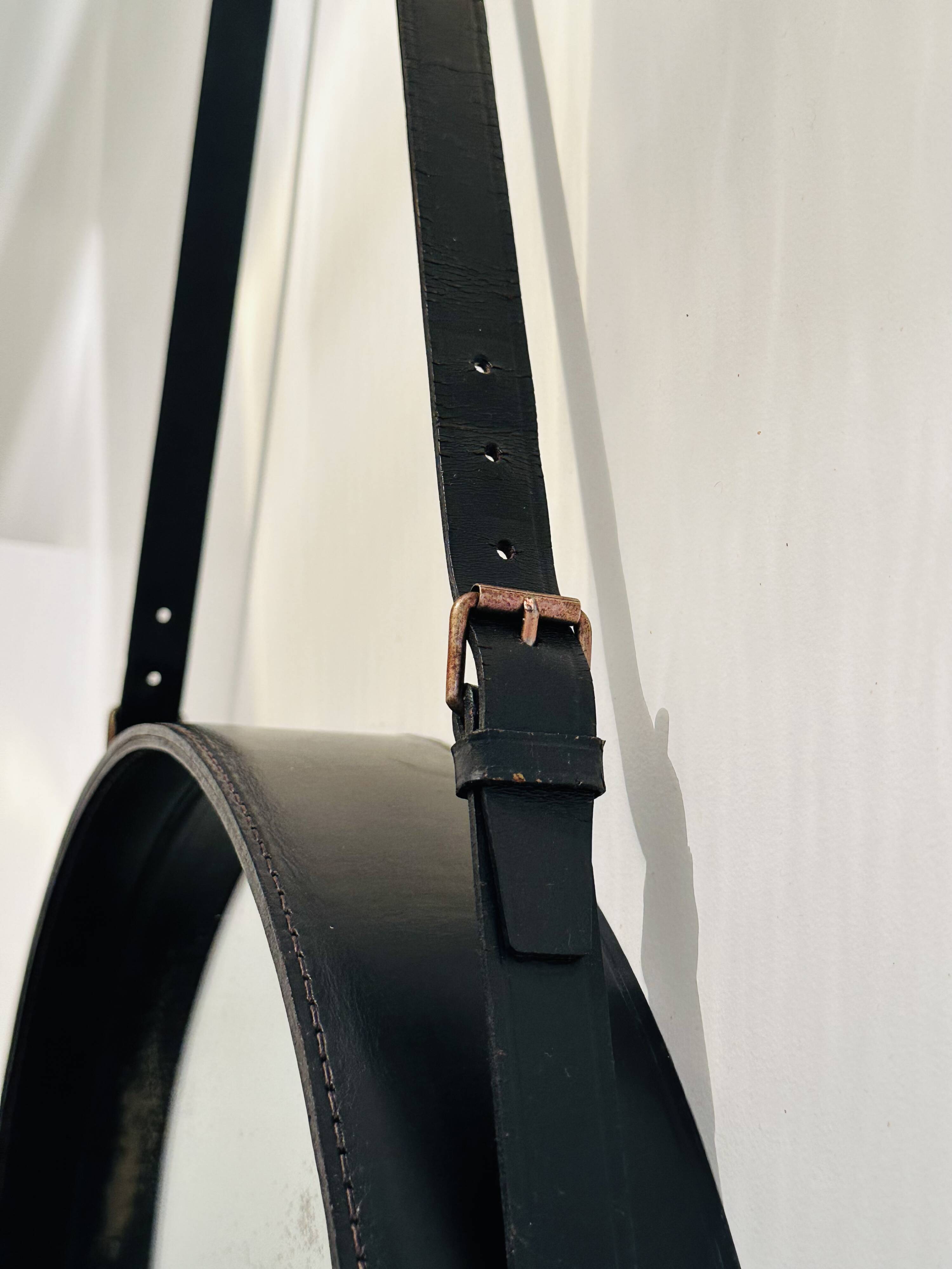 Jacques Adnet circular leather and brass mirror