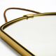 Beautiful small mid-century brass wall mirror with braided hanging strap