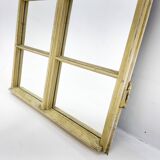 Vintage wooden window converted to a mirror