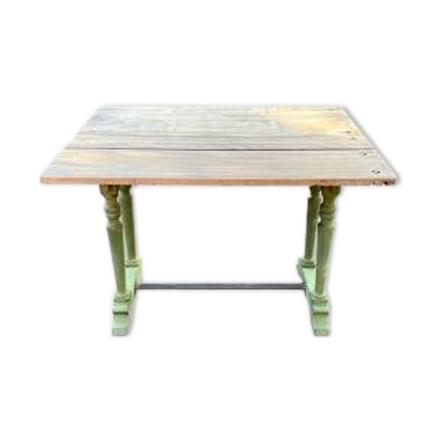 Old table with patinated green legs