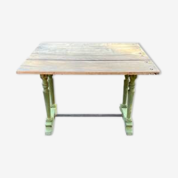 Old table with patinated green legs