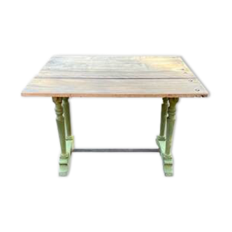 Old table with patinated green legs