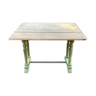 Old table with patinated green legs