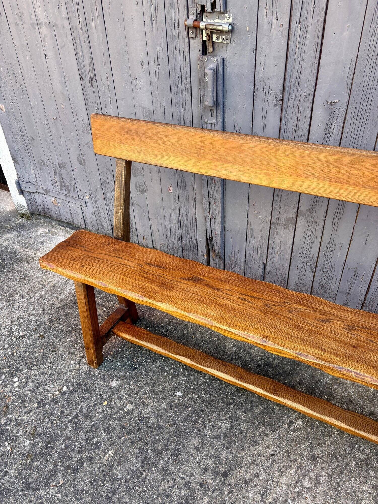 Brutalist bench with dark wood back