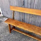 Brutalist bench with dark wood backrest