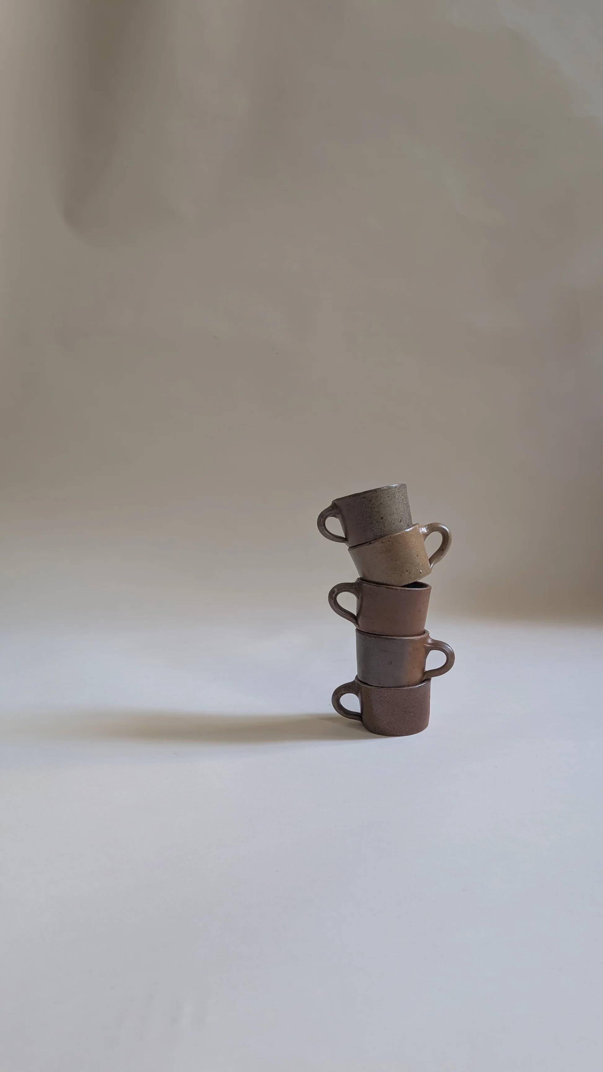 Set of 5 brown stoneware cups