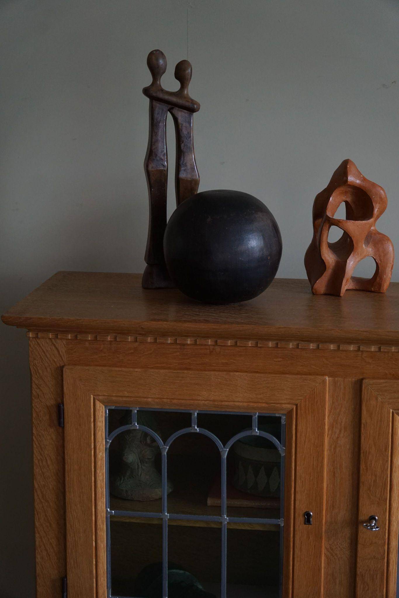 20th-century solid oak display cabinet with a glass front, by a Danish cabinetmaker.