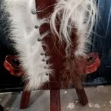 Pair of brutalist tripod chairs in wood and cowhide