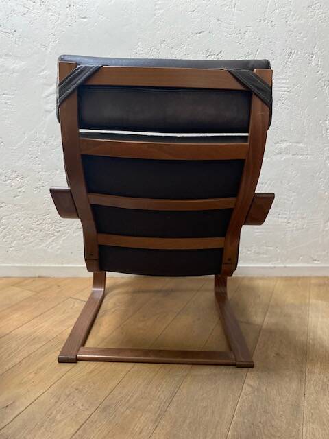 Leather armchair with footrest
