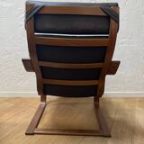 Leather armchair with footrest