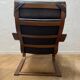Leather armchair with footrest
