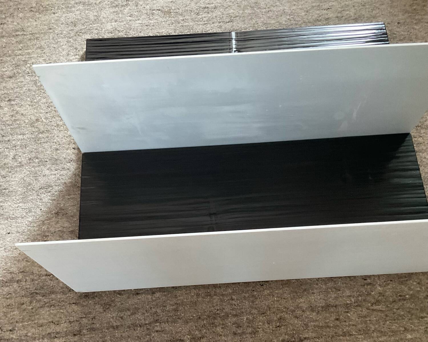 Pair of contemporary shelves in steel and stained wood