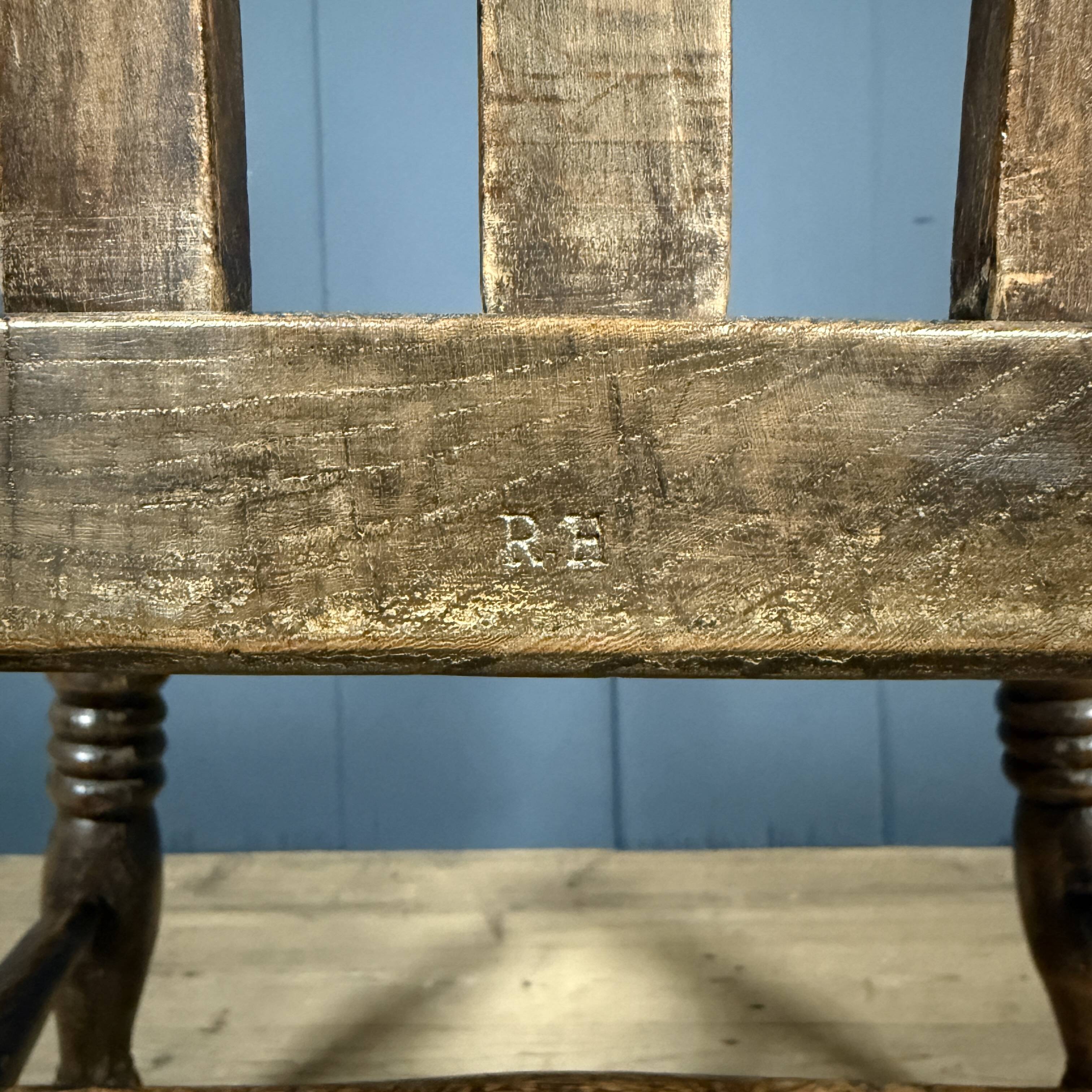 Brown English Windsor armchair with high back