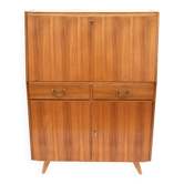 Vintage secretary with drawers, drop-down and doors from the 1960s.