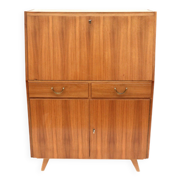 Vintage secretary with drawers, drop-down and doors from the 1960s.