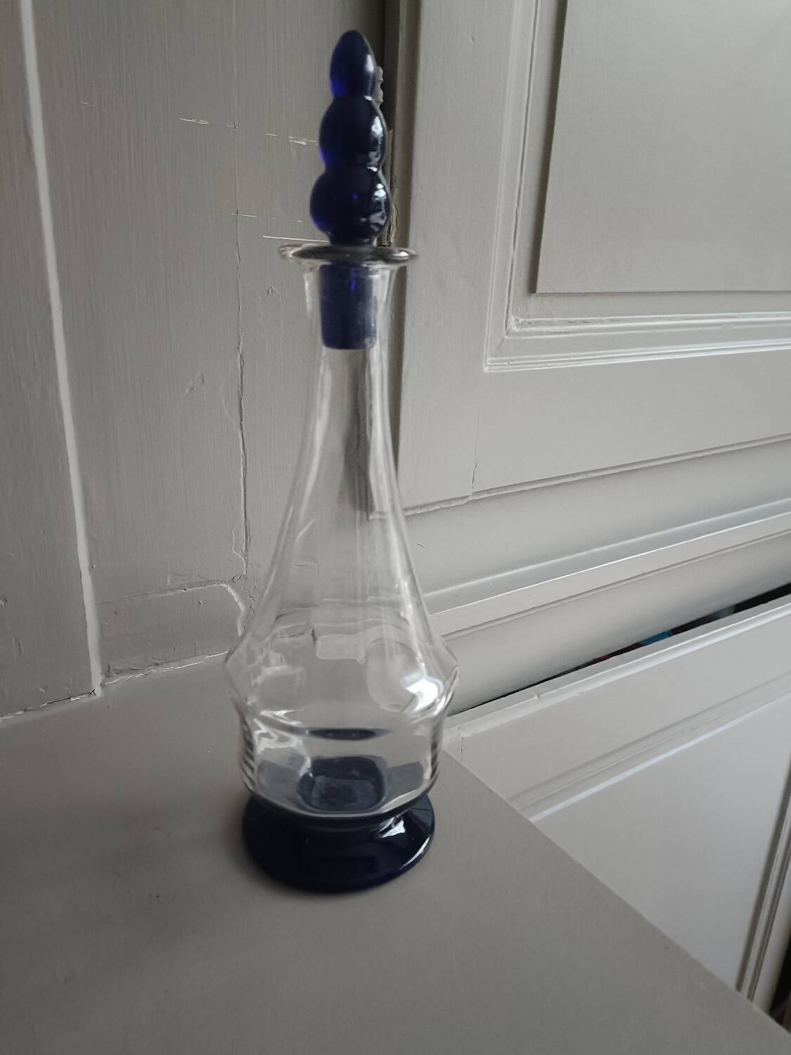 White and blue blown glass carafe