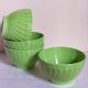 Four vintage spring green earthenware bowls
