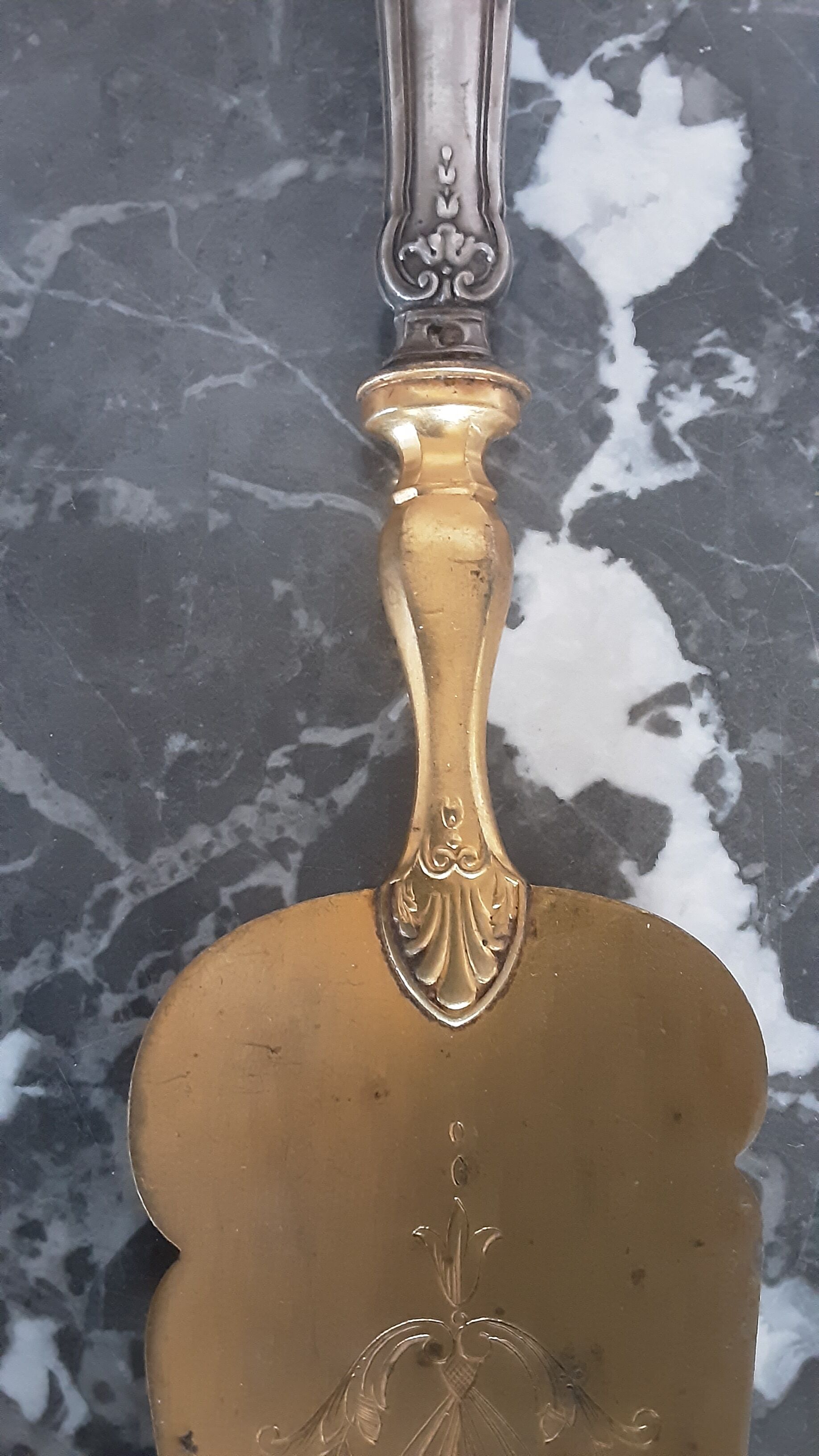 Old brass and silver pie shovel