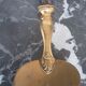 Old brass and silver pie shovel