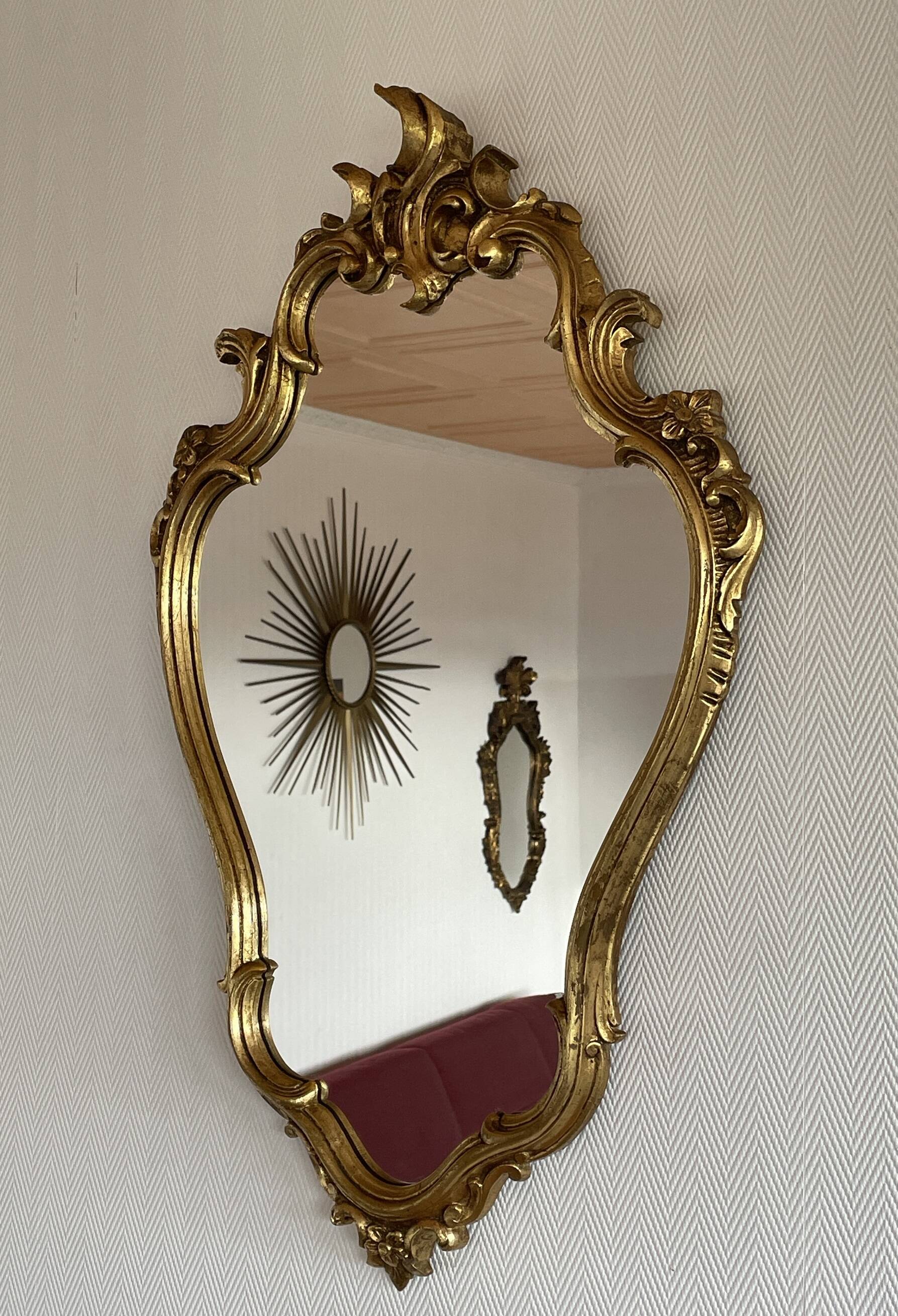 Old baroque style wall mirror with golden moldings