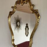 Old baroque style wall mirror with golden moldings