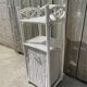 Small white wicker bathroom shelf