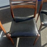 Scandinavian chairs in teak and black skaï.