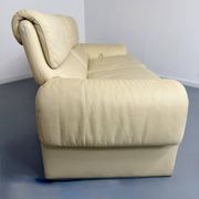 Two-seater designer sofa De Sede DS-2011 in cream leather with adjustable backrest.