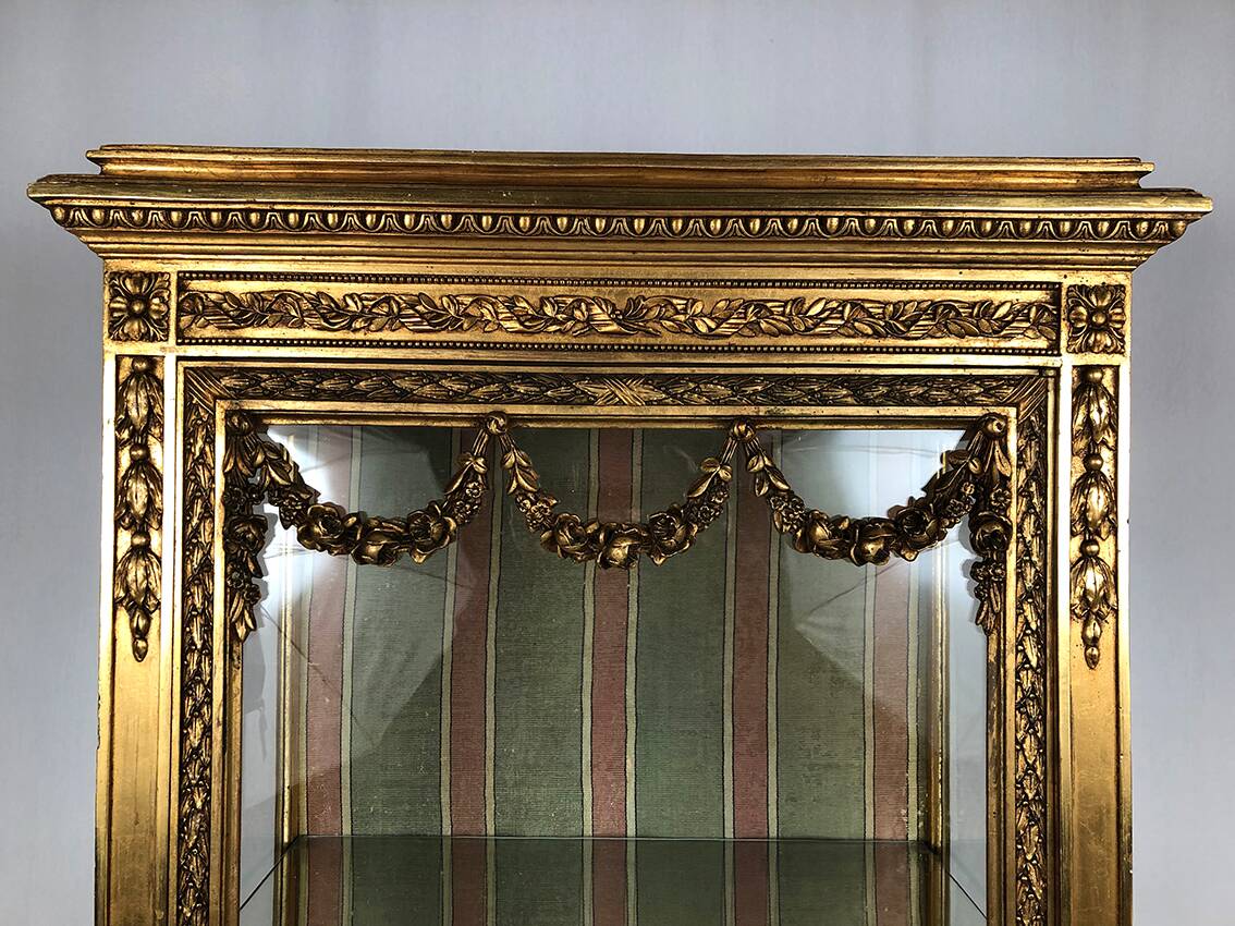 Louis XVI style showcase in wood and gilded stucco, circa 1900