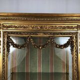 Louis XVI style showcase in wood and gilded stucco, circa 1900