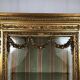 Louis XVI style showcase in wood and gilded stucco, circa 1900