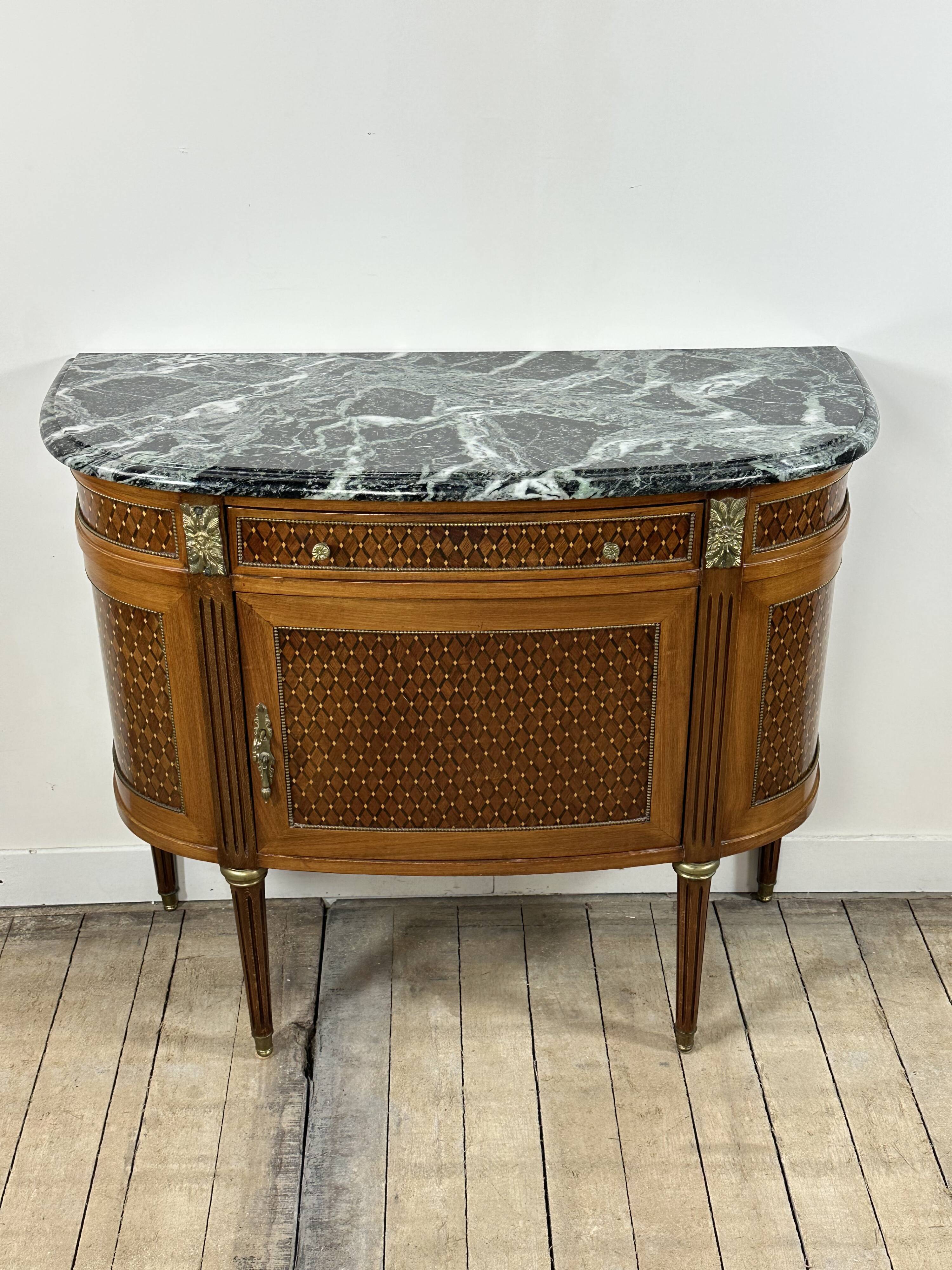 Half-moon commode in the Louis XVI style