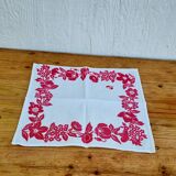 Set of 4 vintage white table napkins with pink flowers.