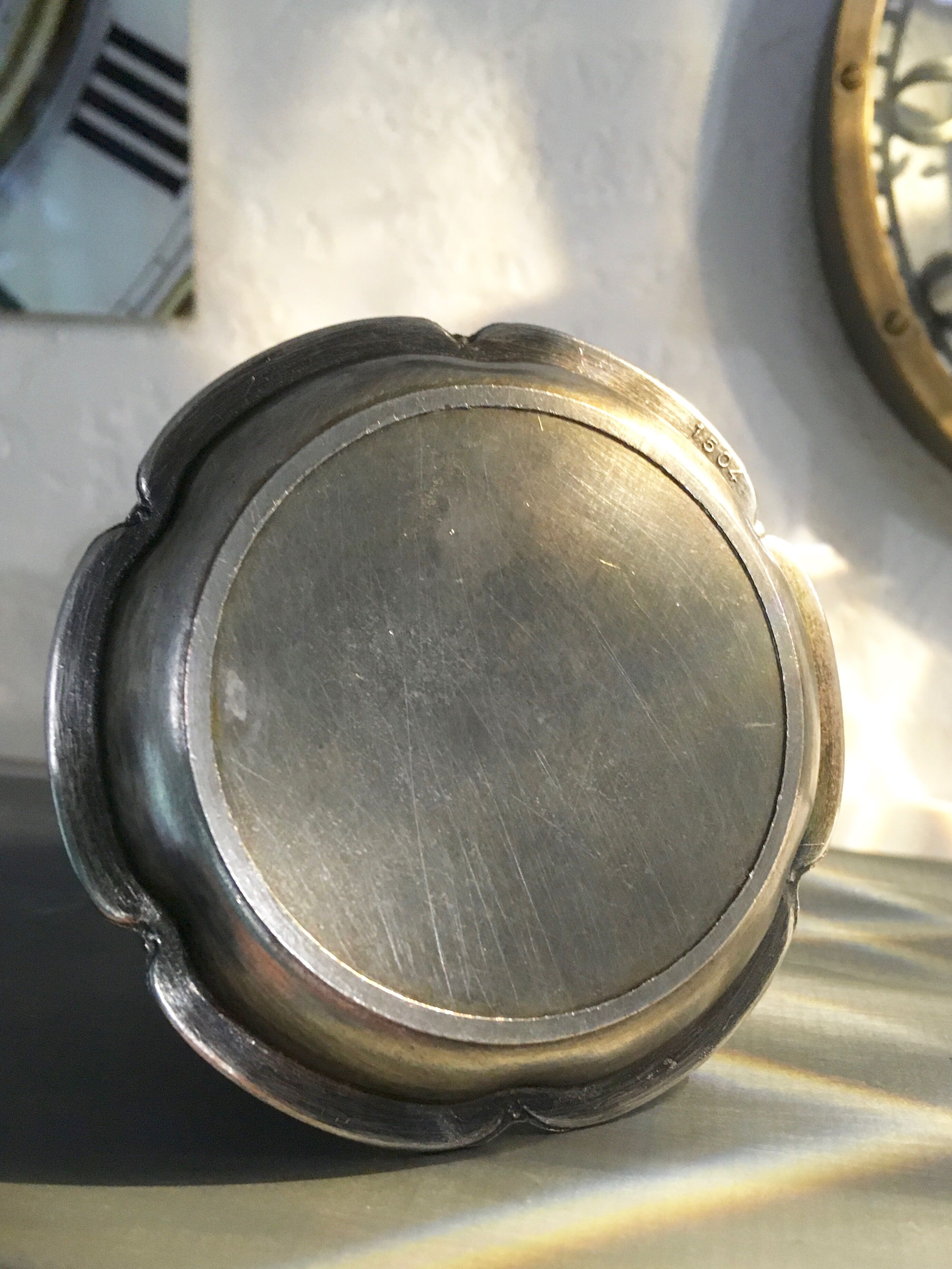 Chiseled silver metal candle holder