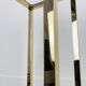 Gilded metal fifth wheel column and Hollywood Regency style glass 70s