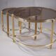 Set de trois tables basses gigognes en bronze et verre fumé, années 70