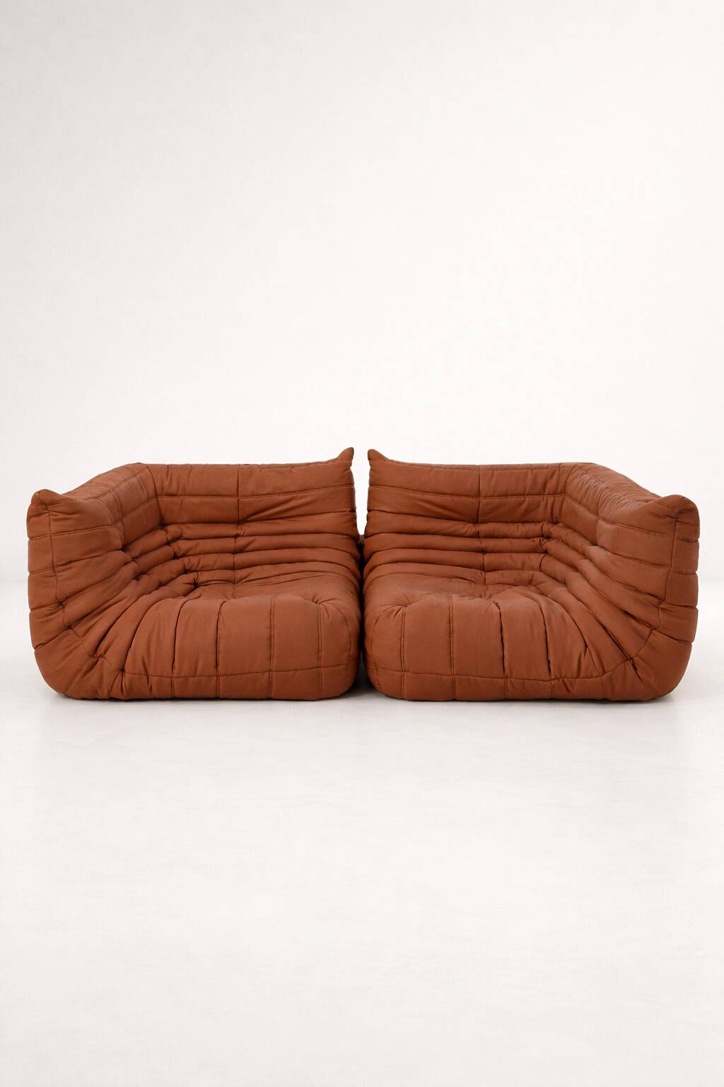 A set of 2 LIGNE ROSET brown corner togos.