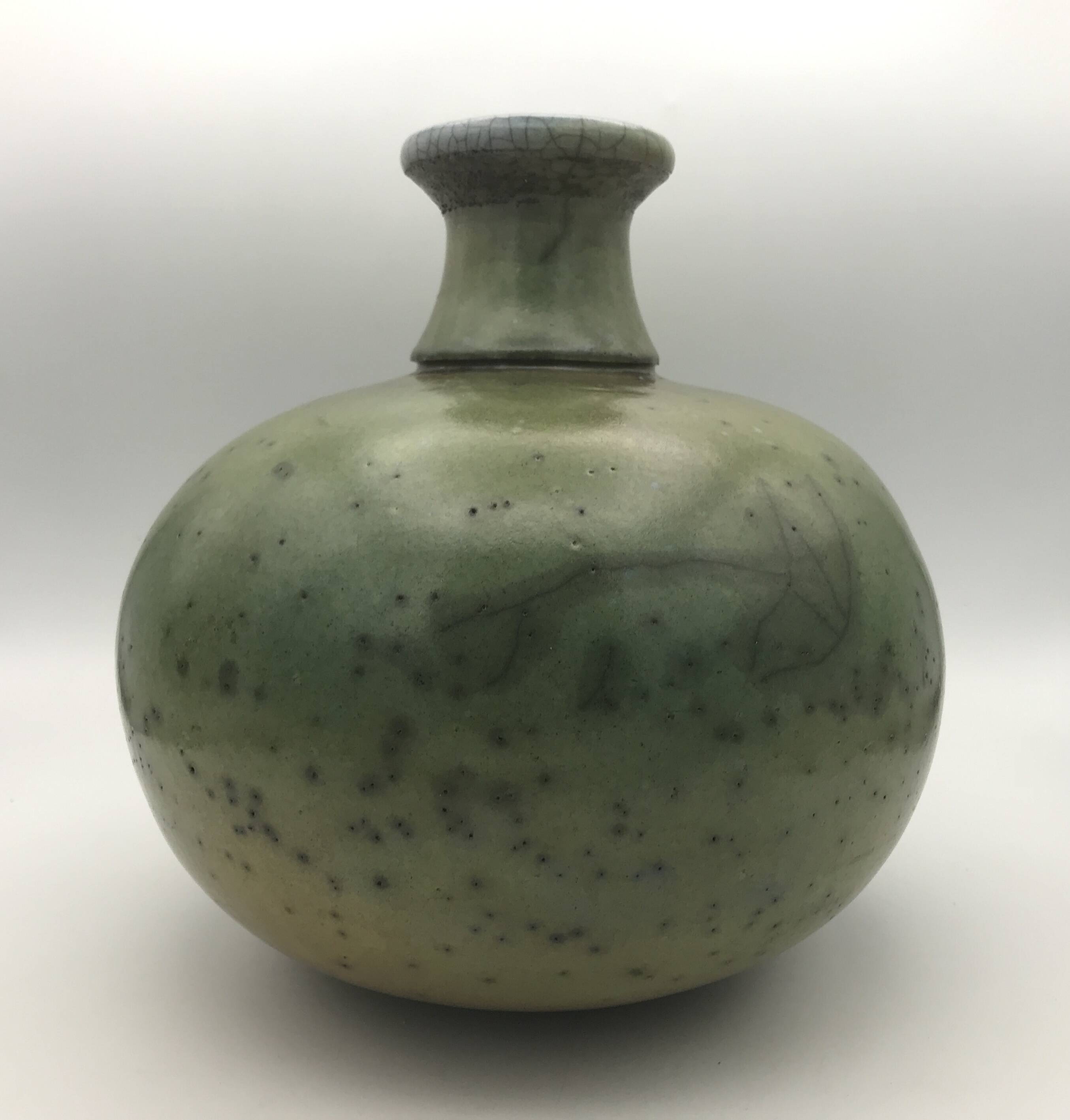 Contemporary vase ball shape raku shades of green and yellow
