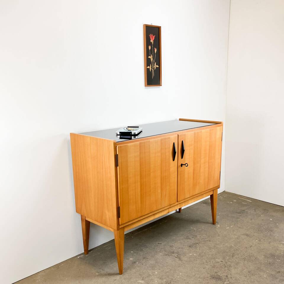 Small sideboard, WK Möbel, light coloured veneer with black glass top, 50s