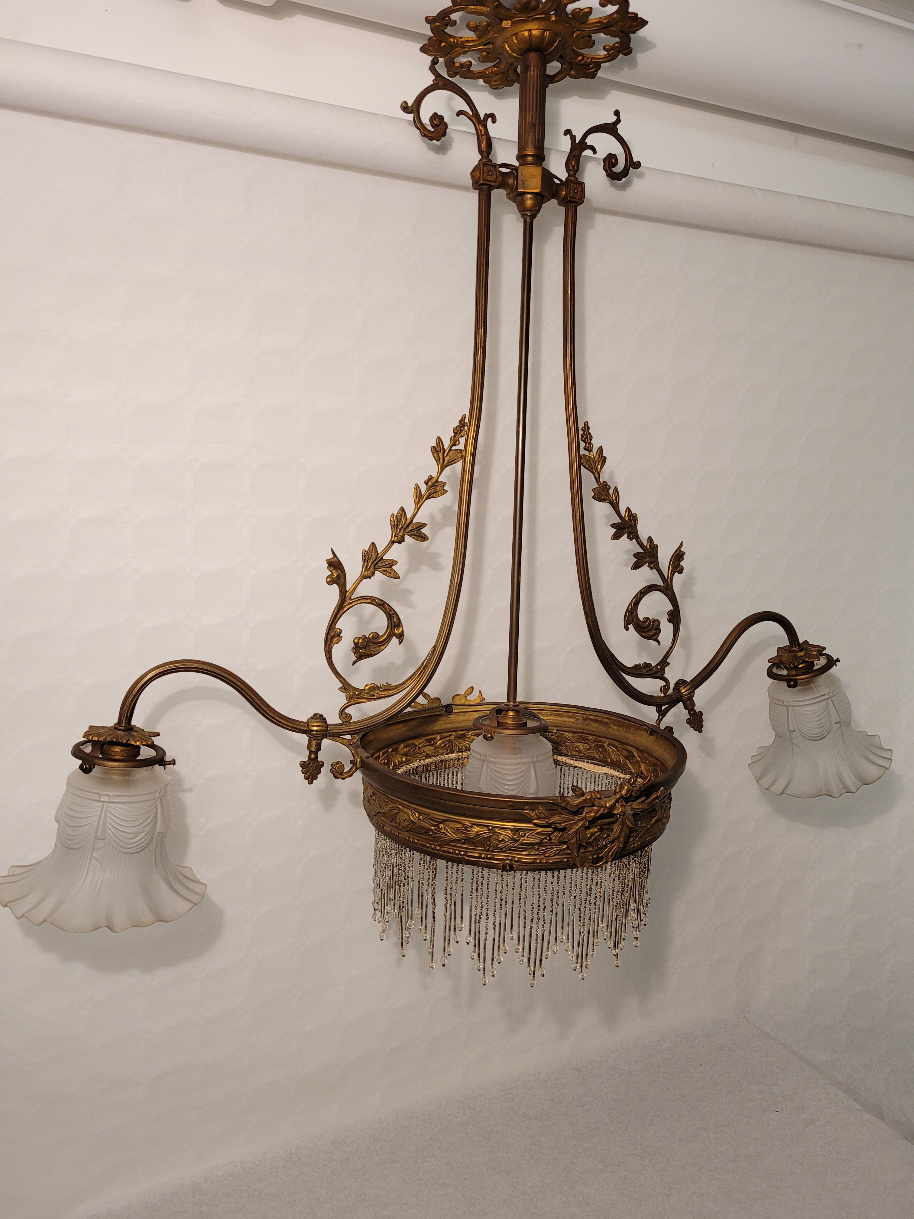 Gold metal chandelier and three-light beads