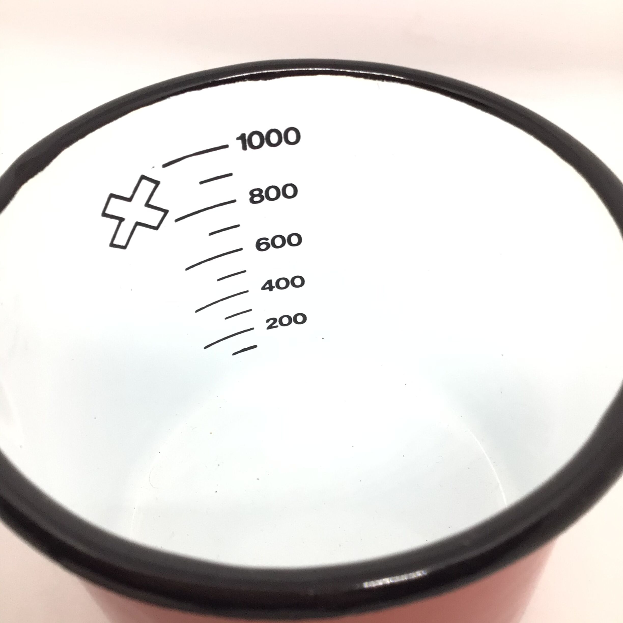 Red pitcher in enamelled metal